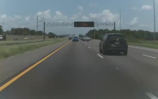 Hyundai Ioniq 5 forward-camera frame on an interstate