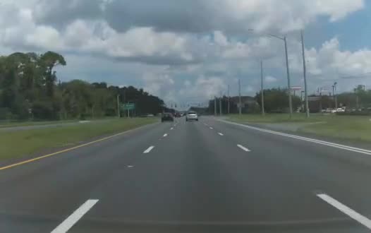 Tesla Model 3 forward-camera frame on a highway
