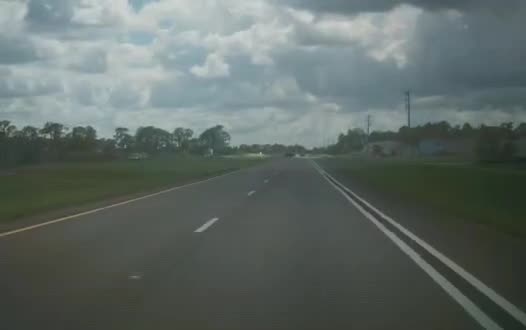 Tesla Model X forward-camera frame on a multi-lane road