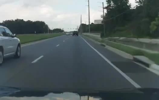 Toyota RAV4 forward-camera frame on a highway